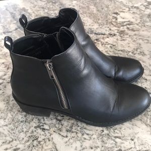 Black booties with zipper details